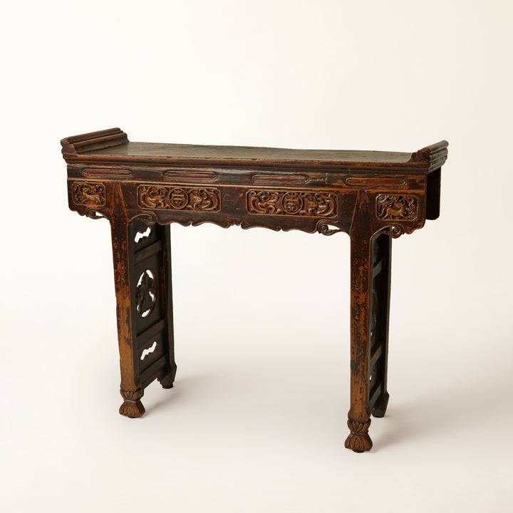 Decorative wooden altar console table with intricate carvings 