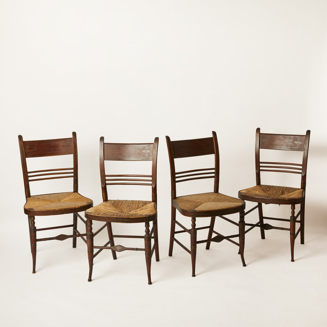 Four wooden shearton chairs with rush seats 
