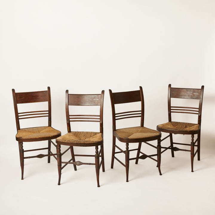 Four wooden shearton chairs with rush seats 