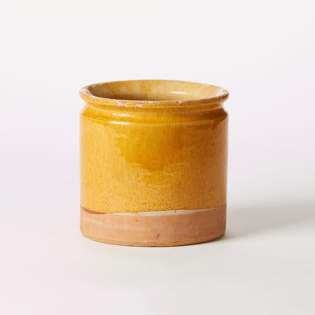 Yellow ceramic jar on a white background