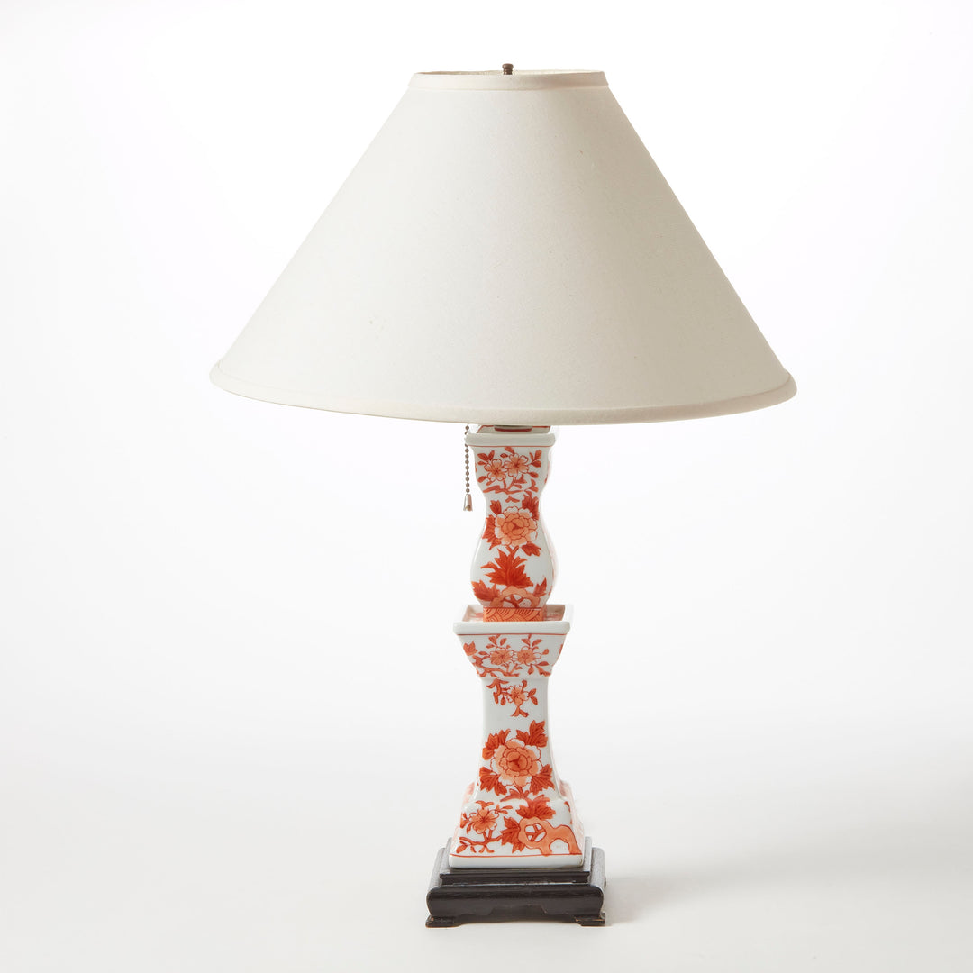 Decorative table lamp with floral pattern on a white background