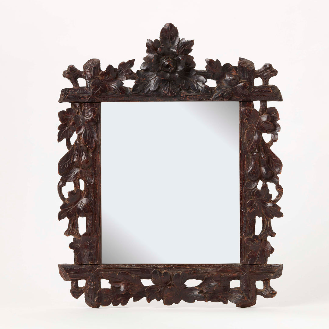 wooden mirror with Richly detailed floral, leaf, and fruit carving with deep, rich patina.