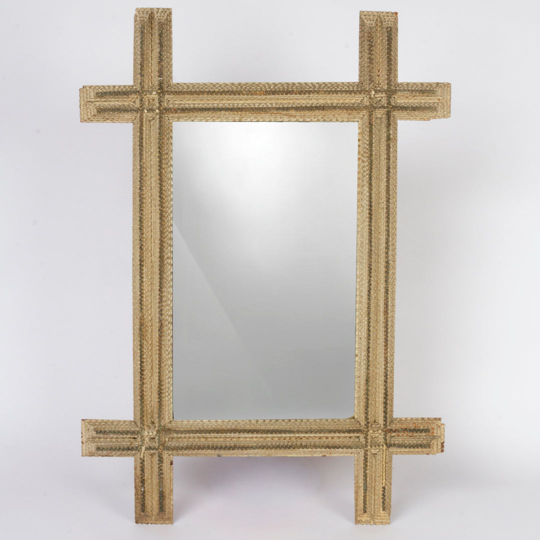 A square decorative mirror with a thick, textured woven frame in a natural tan or straw color, set against a plain light gray background.
