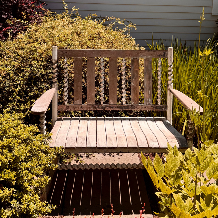 ANTIQUE WOOD GARDEN BENCH WITH FADED WHITEWASHED PAINT
